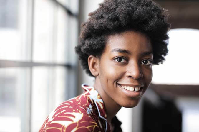 Black woman with Natural Fro professional hairstyle