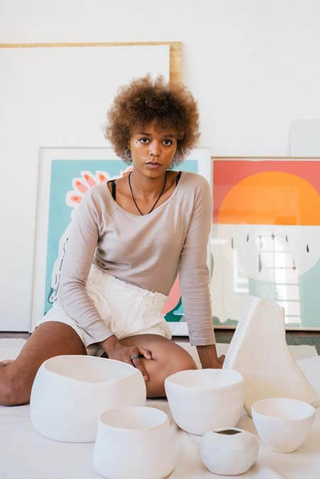 Black woman with Natural blow out curly Hairstyle