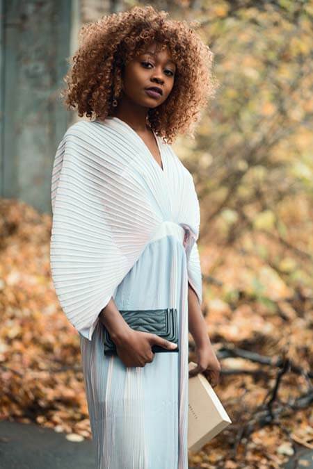 Black woman with Natural Curly professional hairstyle