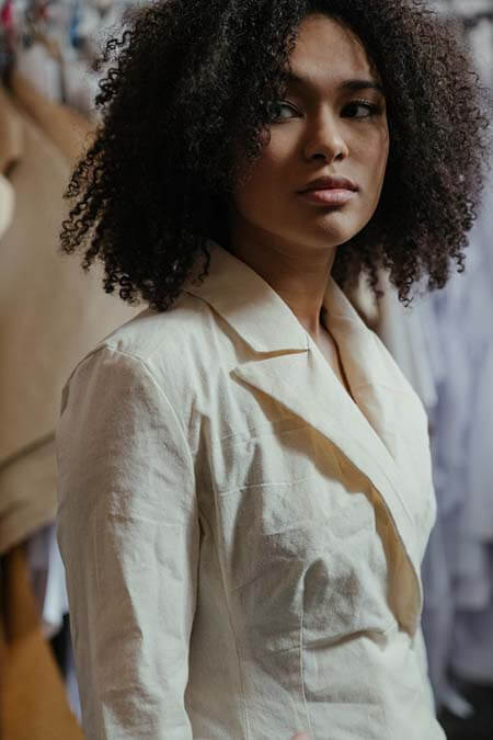 Black woman with Natural Curly professional hairstyle