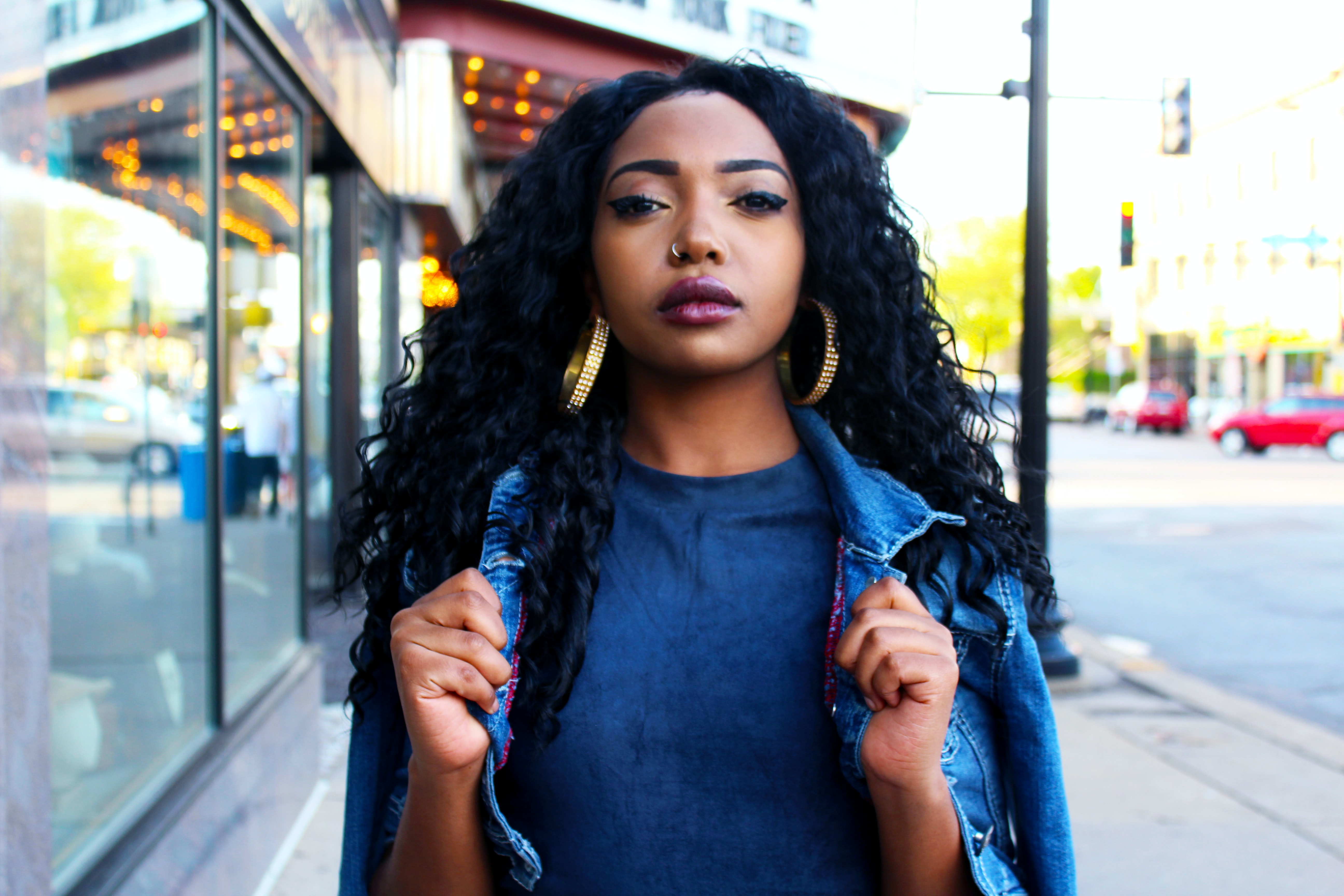 Black woman with long deepwave curls professional hairstyle 