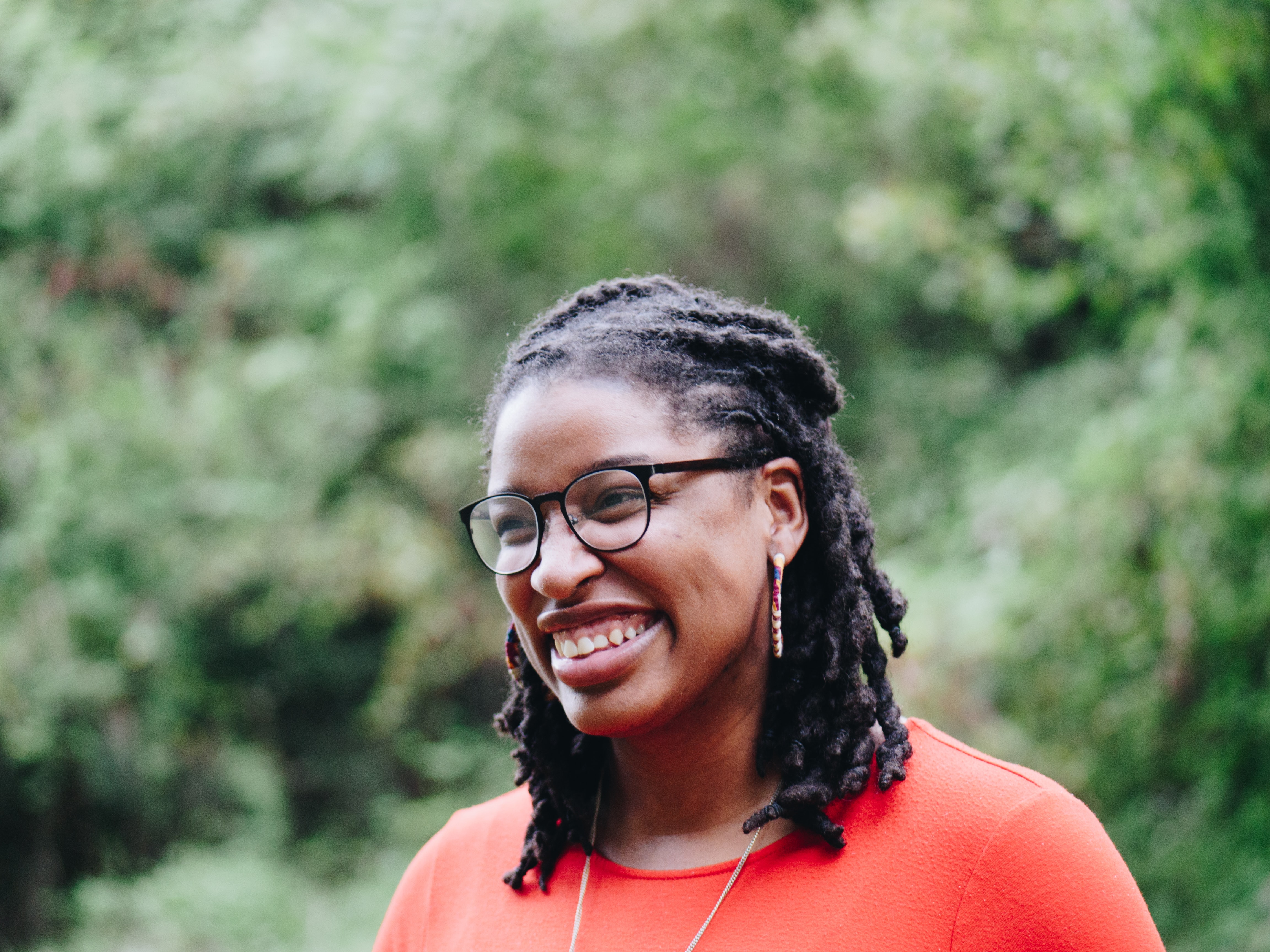 Black woman with styled dreadlocks professional hairstyle